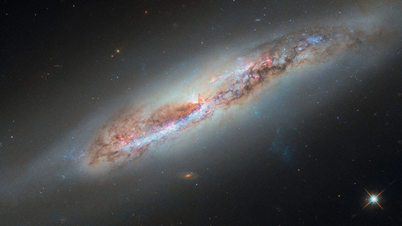 Hubble Glimpses Galactic Gas Making a Getaway
