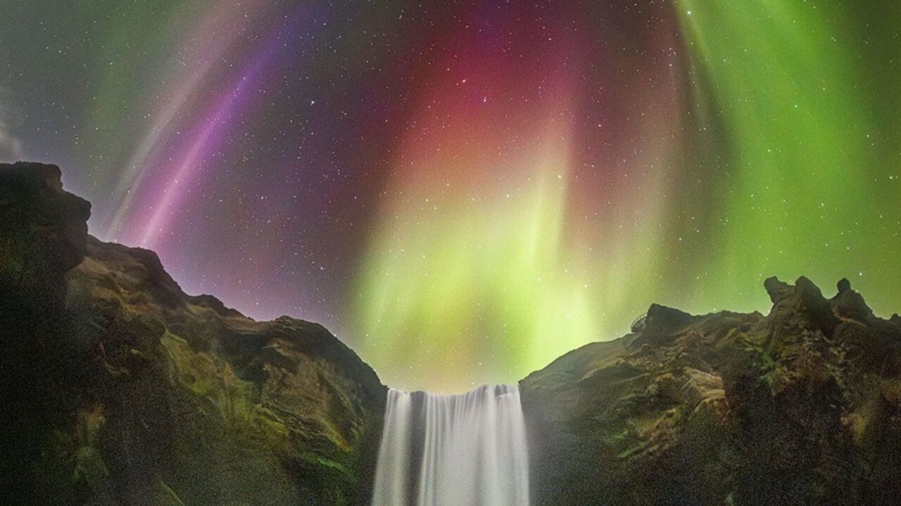 APOD: 2026 August 27 – Colorful Aurora over an Icelandic Waterfall